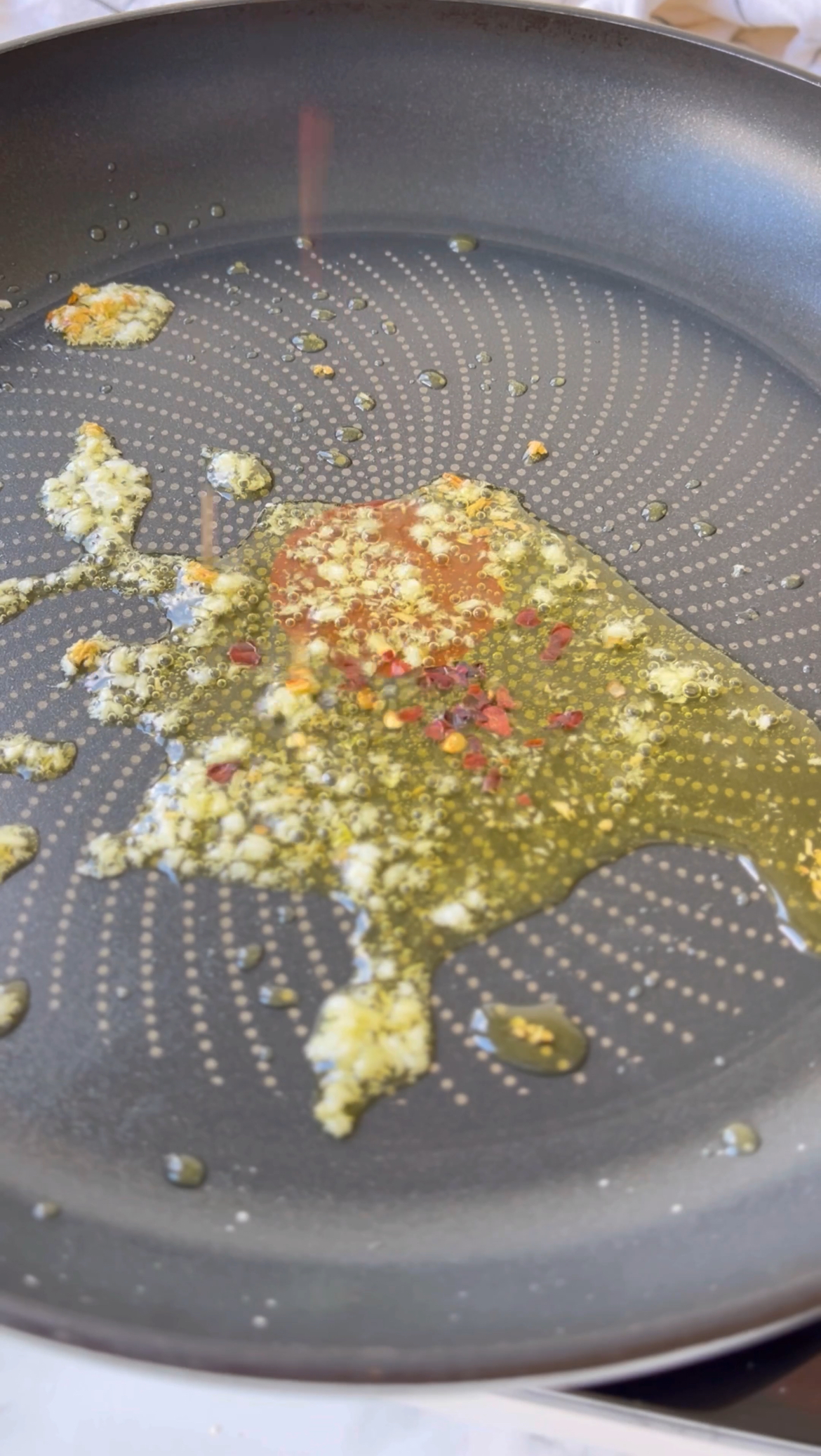 frying garlic and chilli flakes in olive oil