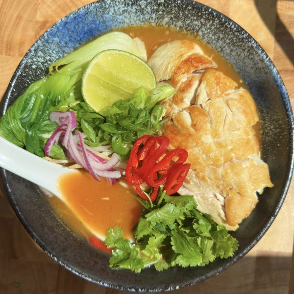 wagamama chilli chicken ramen in a blue bowl with a ramen spoon