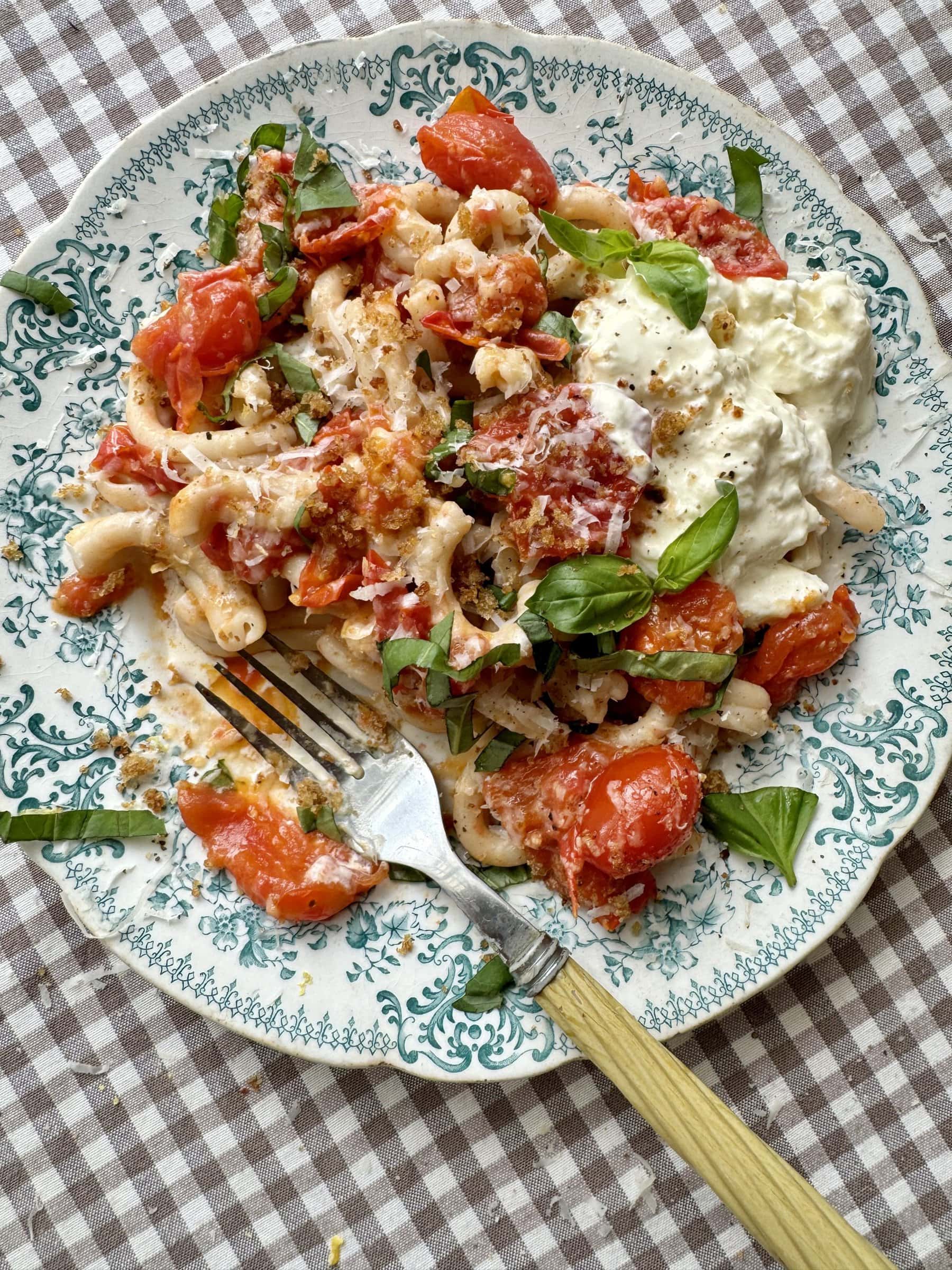 cherry pasta pasta sauce on a blue floral plate