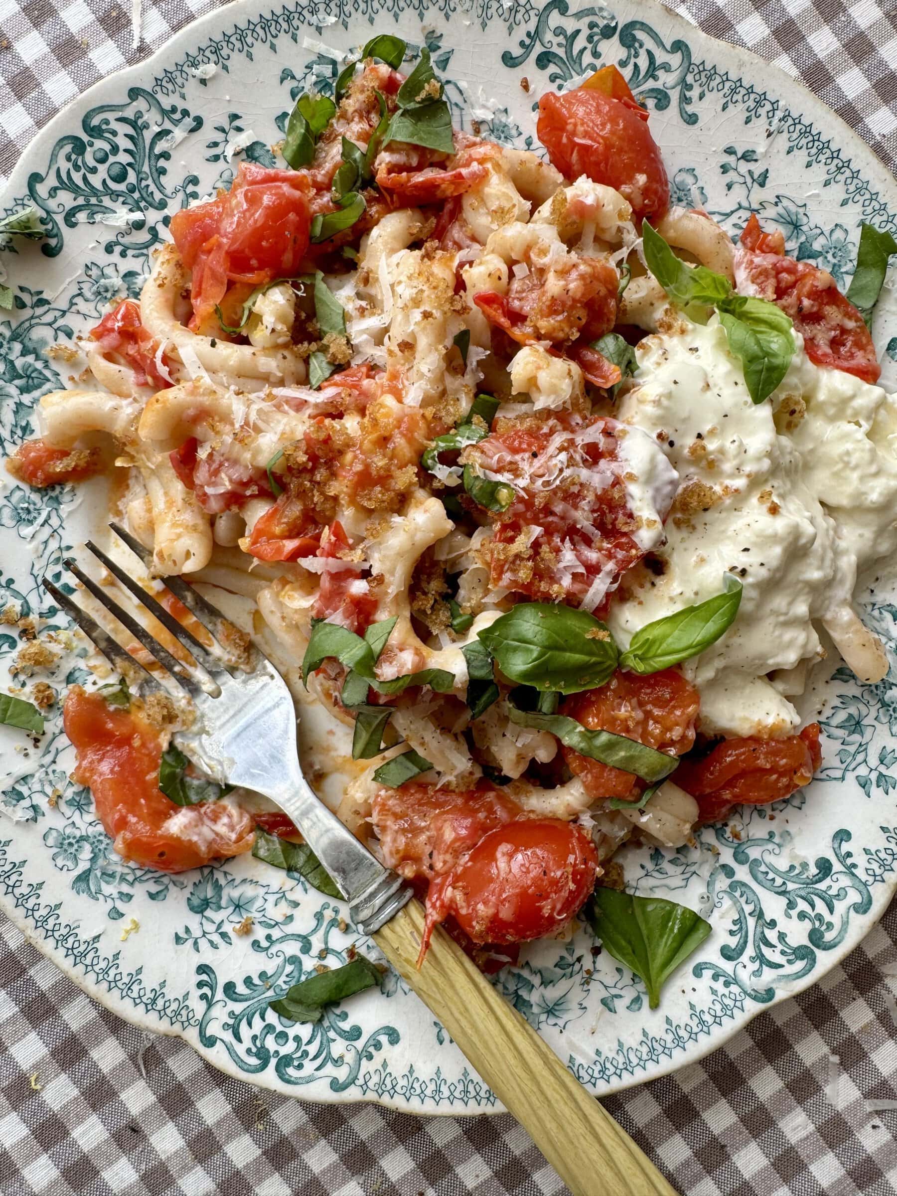 cherry pasta pasta sauce on a blue floral plate