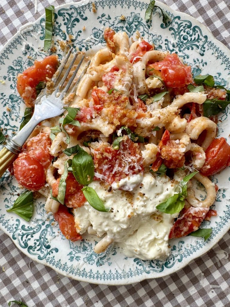 cherry pasta pasta sauce on a blue floral plate