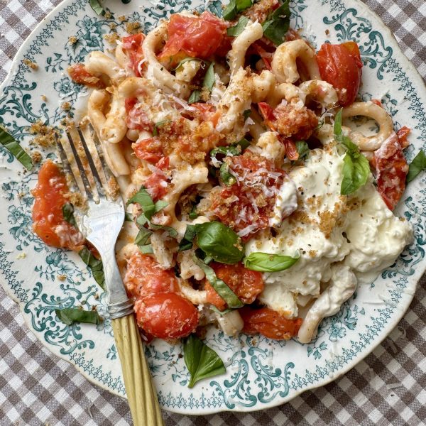 cherry pasta pasta sauce on a blue floral plate