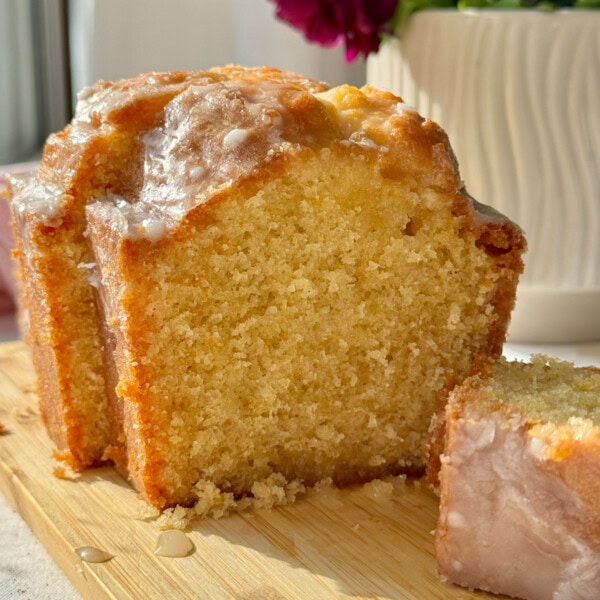 lemon loaf cake on wooden board.