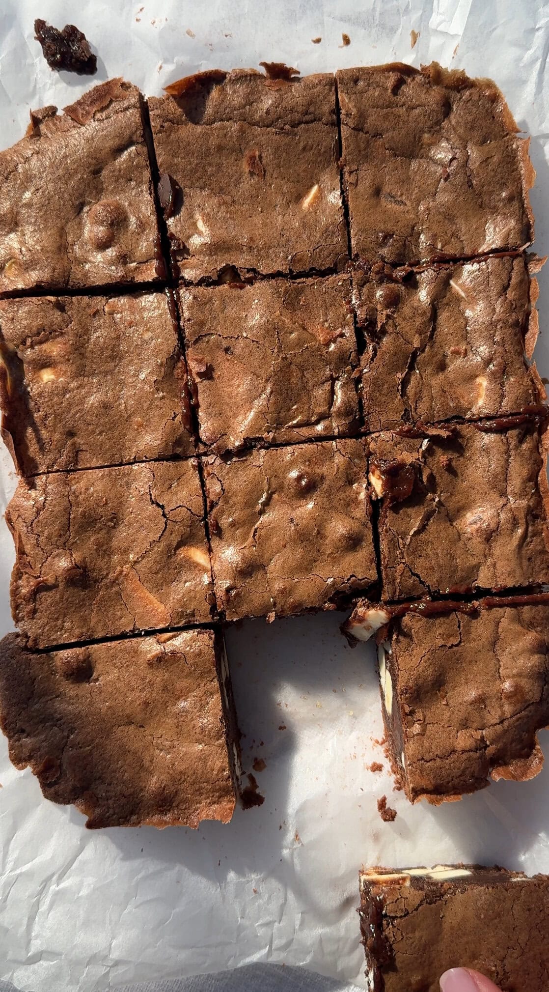 sliced brownies on greaseproof paper.