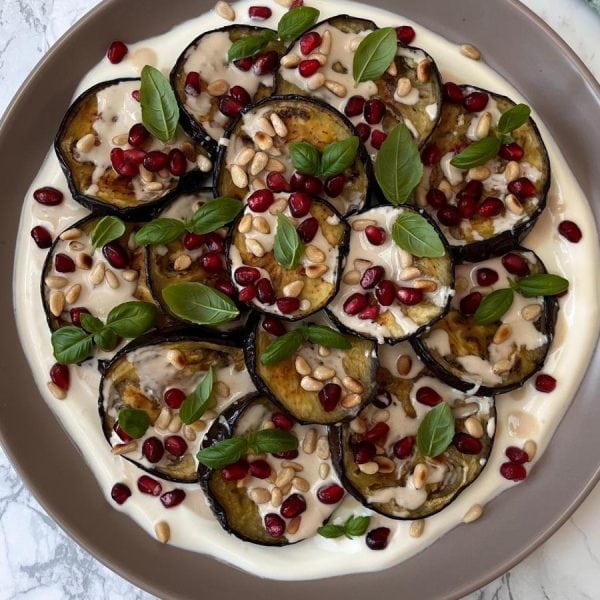 aubergine salad on a grey plate