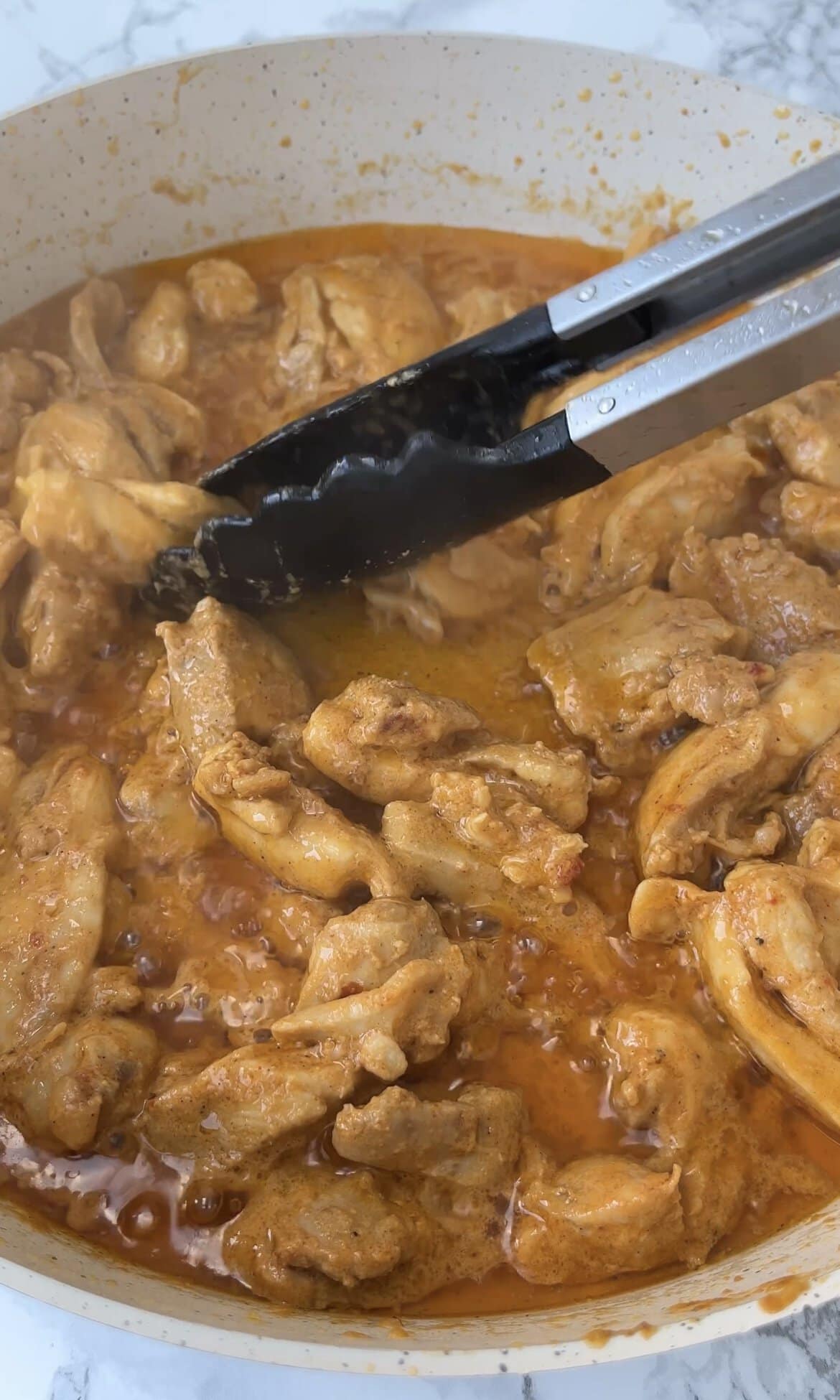 frying harissa chicken.