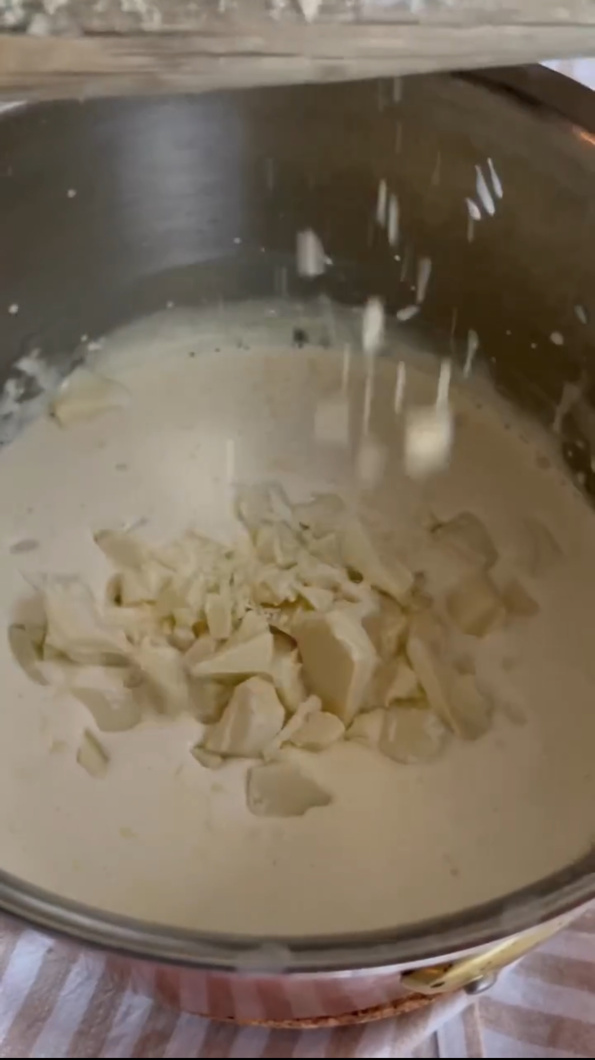 melting white chocolate in cream