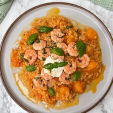 tomato mascarpone risotto with garlic prawns.