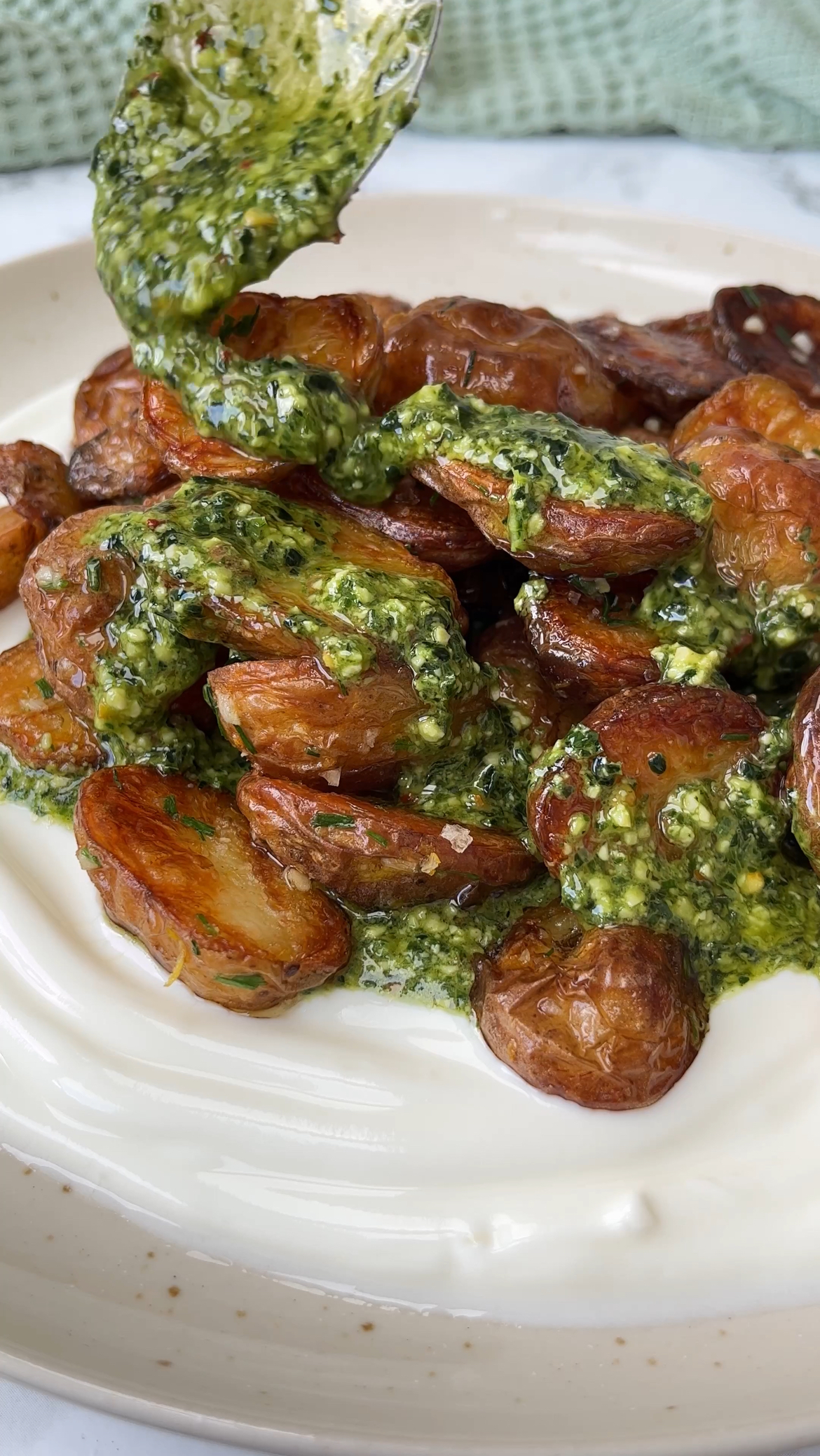 herb roasted potatoes on yoghurt with chimichurri