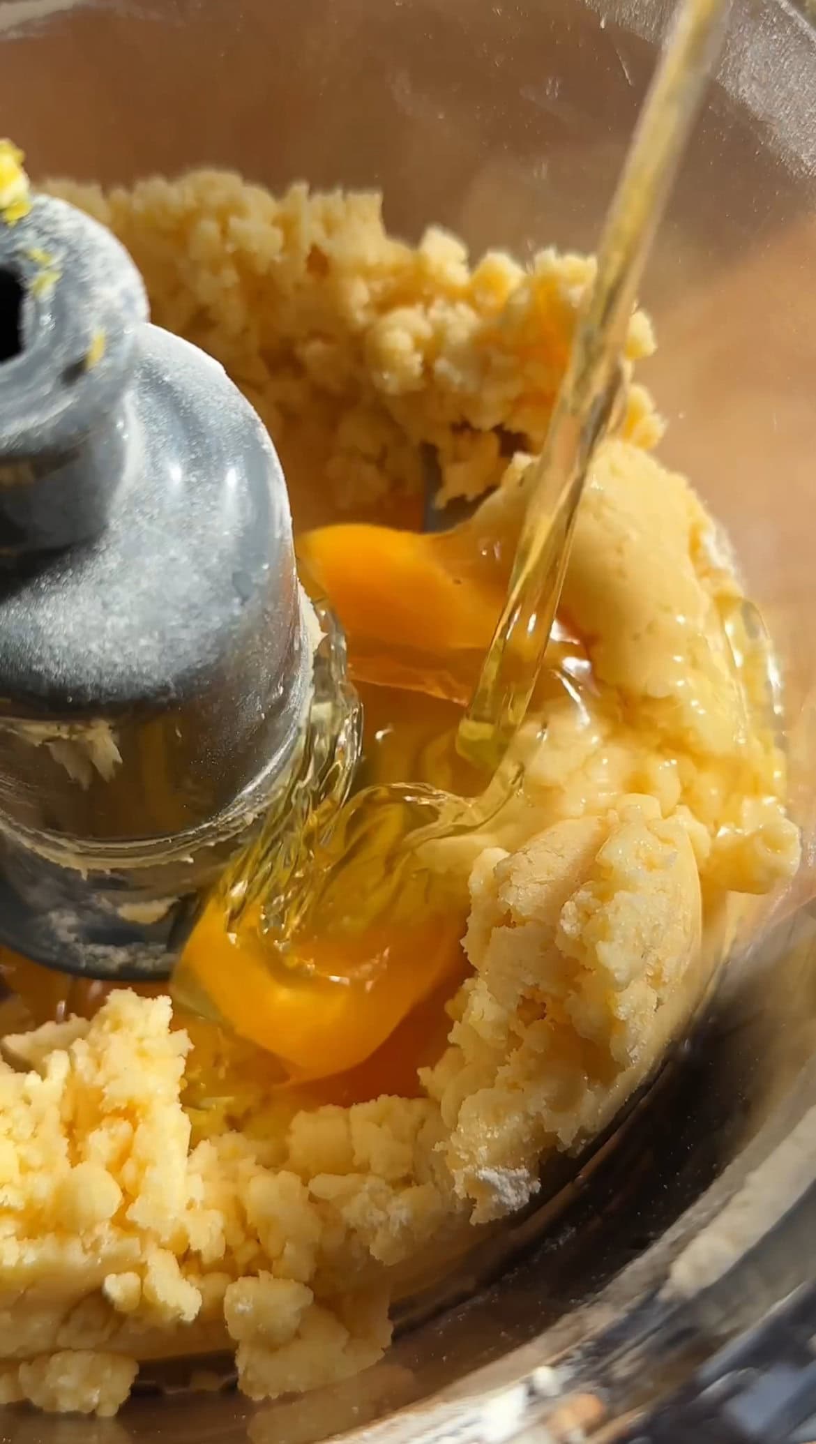 adding eggs to the lemon loaf cake.