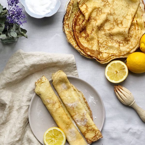 british pancakes on plate with lemon halves