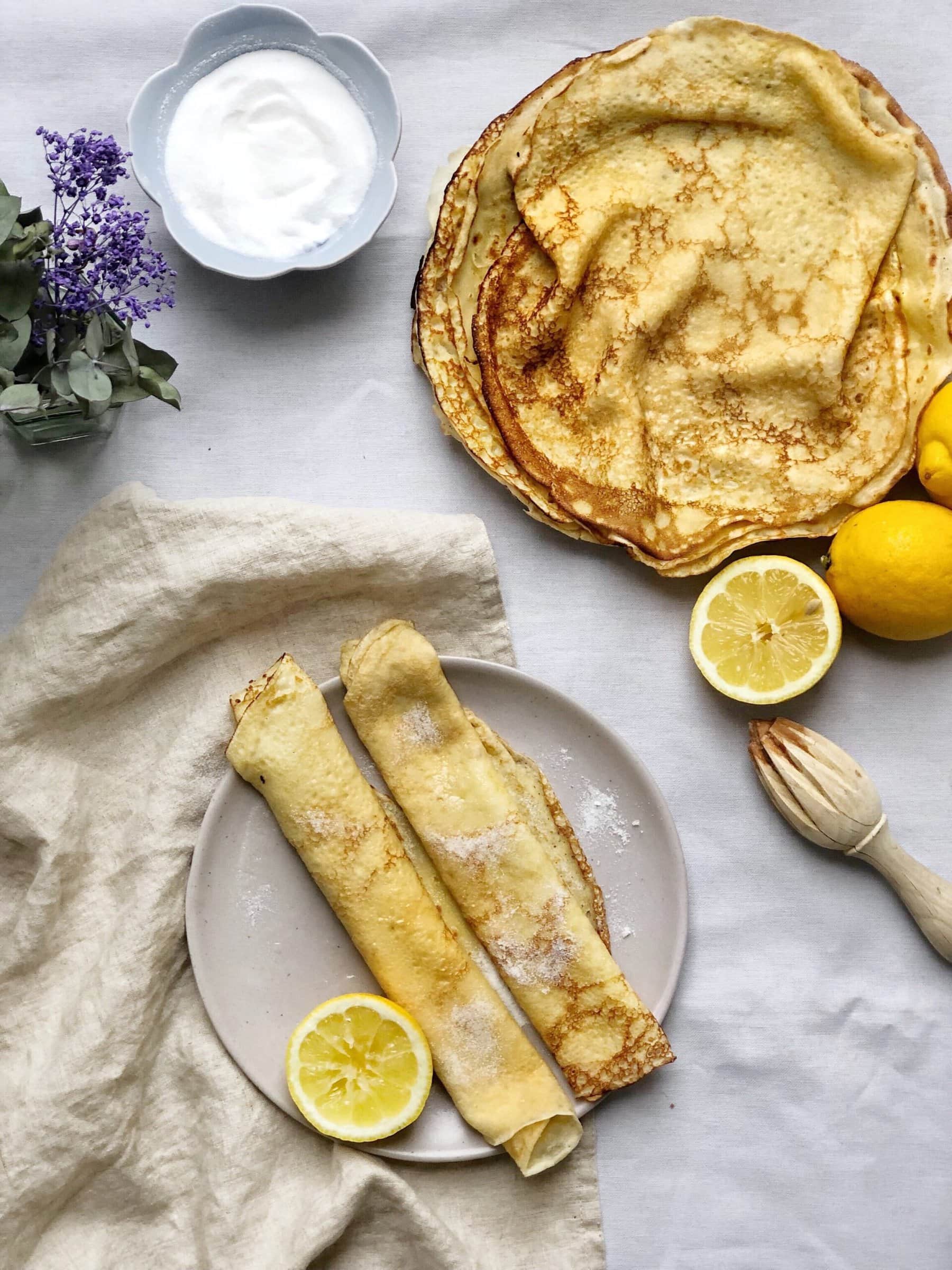 british pancakes on plate with lemon halves