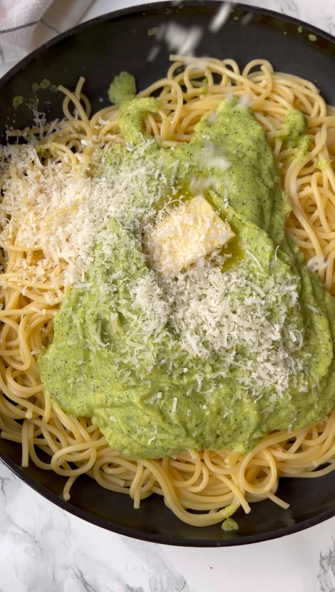 tossing the sauce together for spaghetti alla nerano