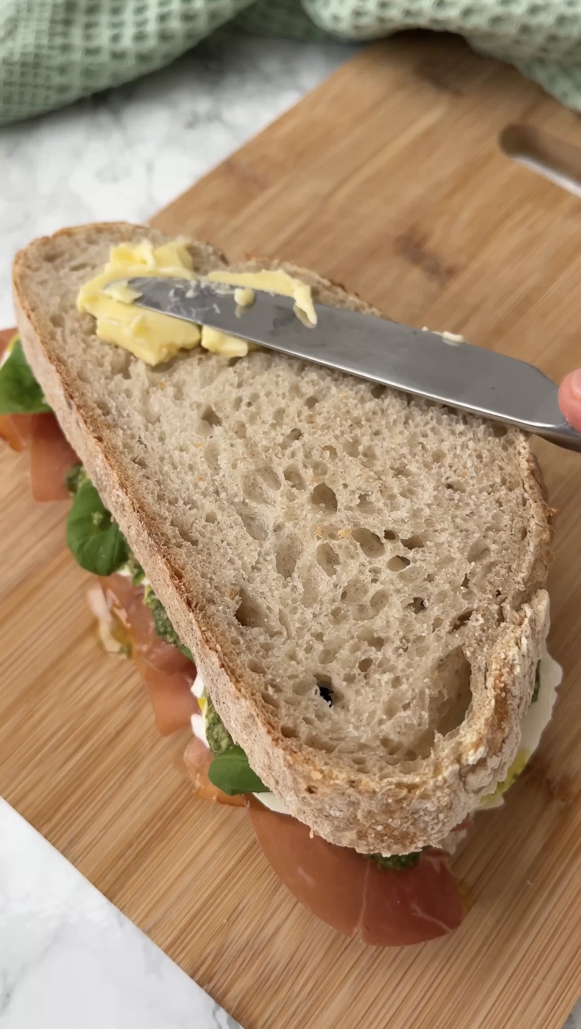 buttering the exterior of the bread