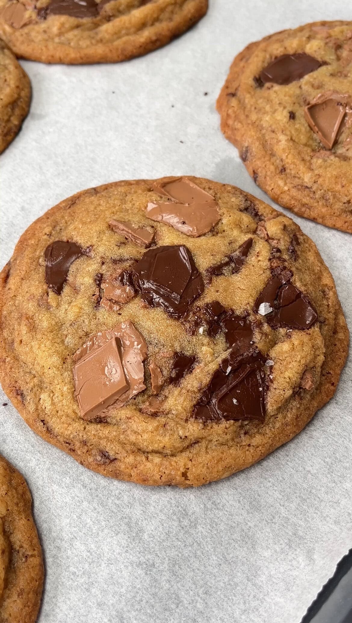 triple chunk chocolate cookies on a baking tray.