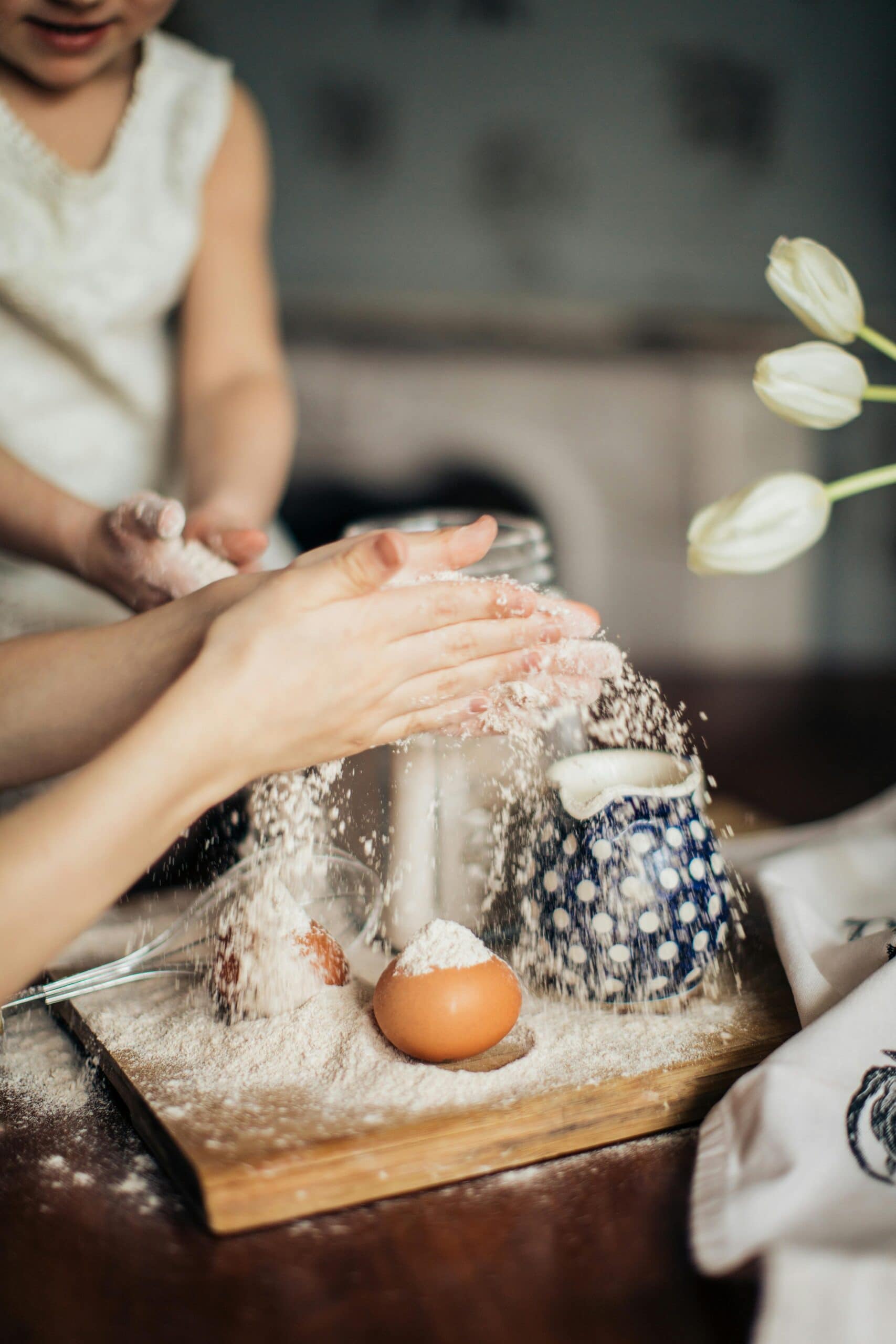 woman mixing self raising flour with plain flour.