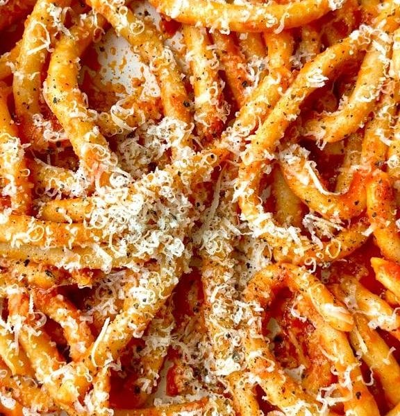 Tomato sauce tossed through pasta