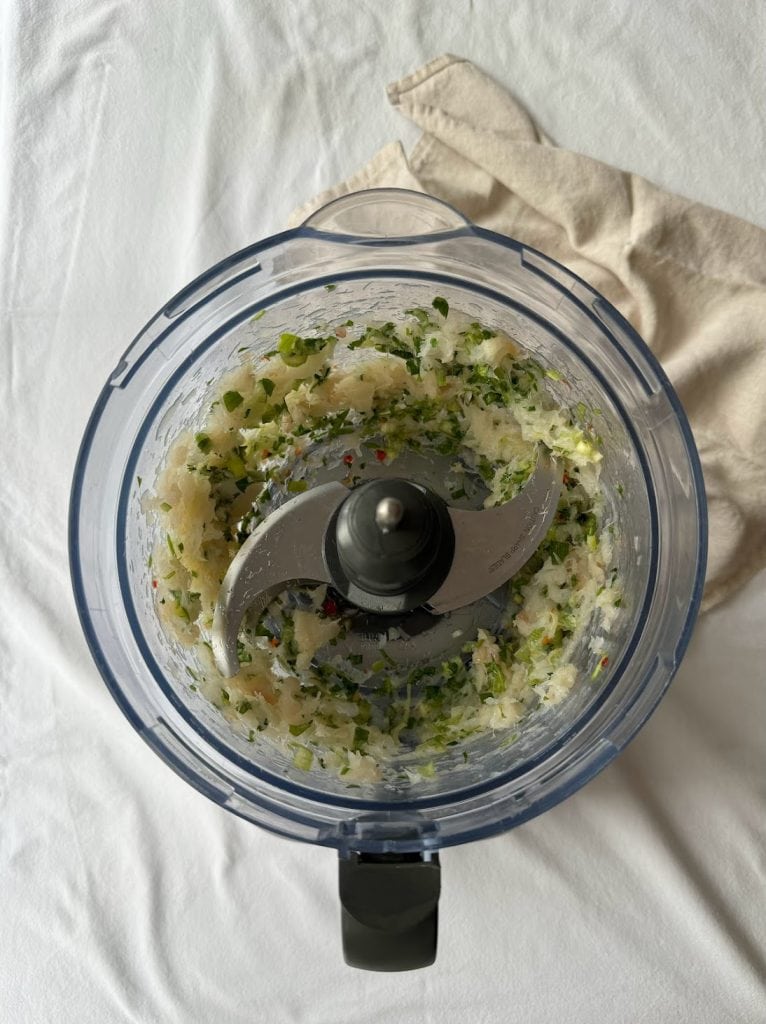 Blitzed fish cake ingredients in a food processor.