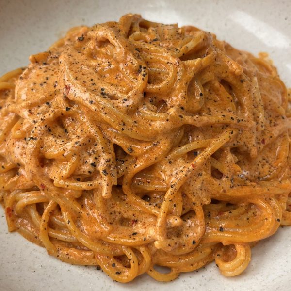 Spicy Nduja Pasta on a beige bowl