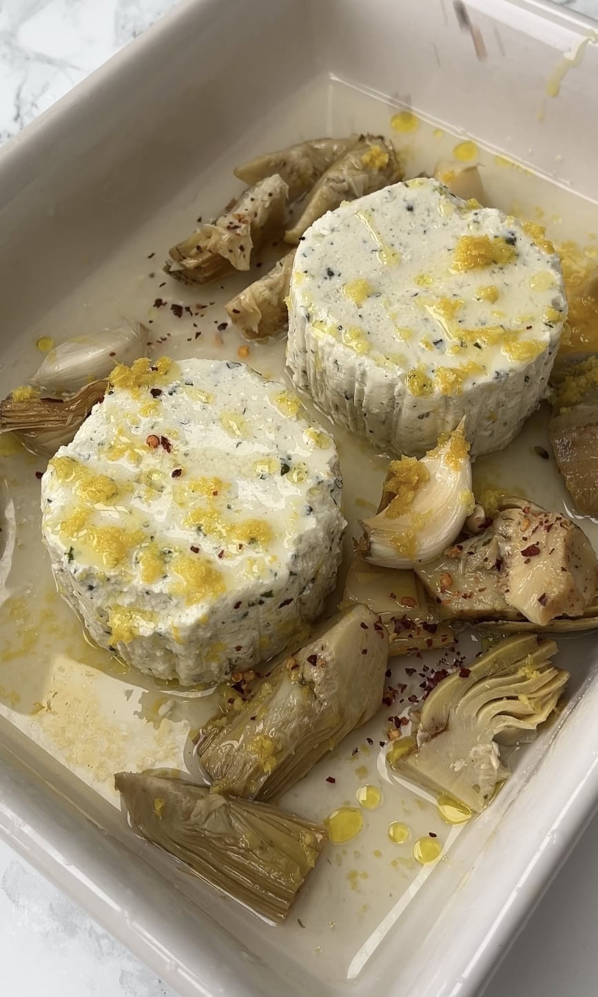 baking tray of boursin, lemon zest, artichokes and chilli flakes.