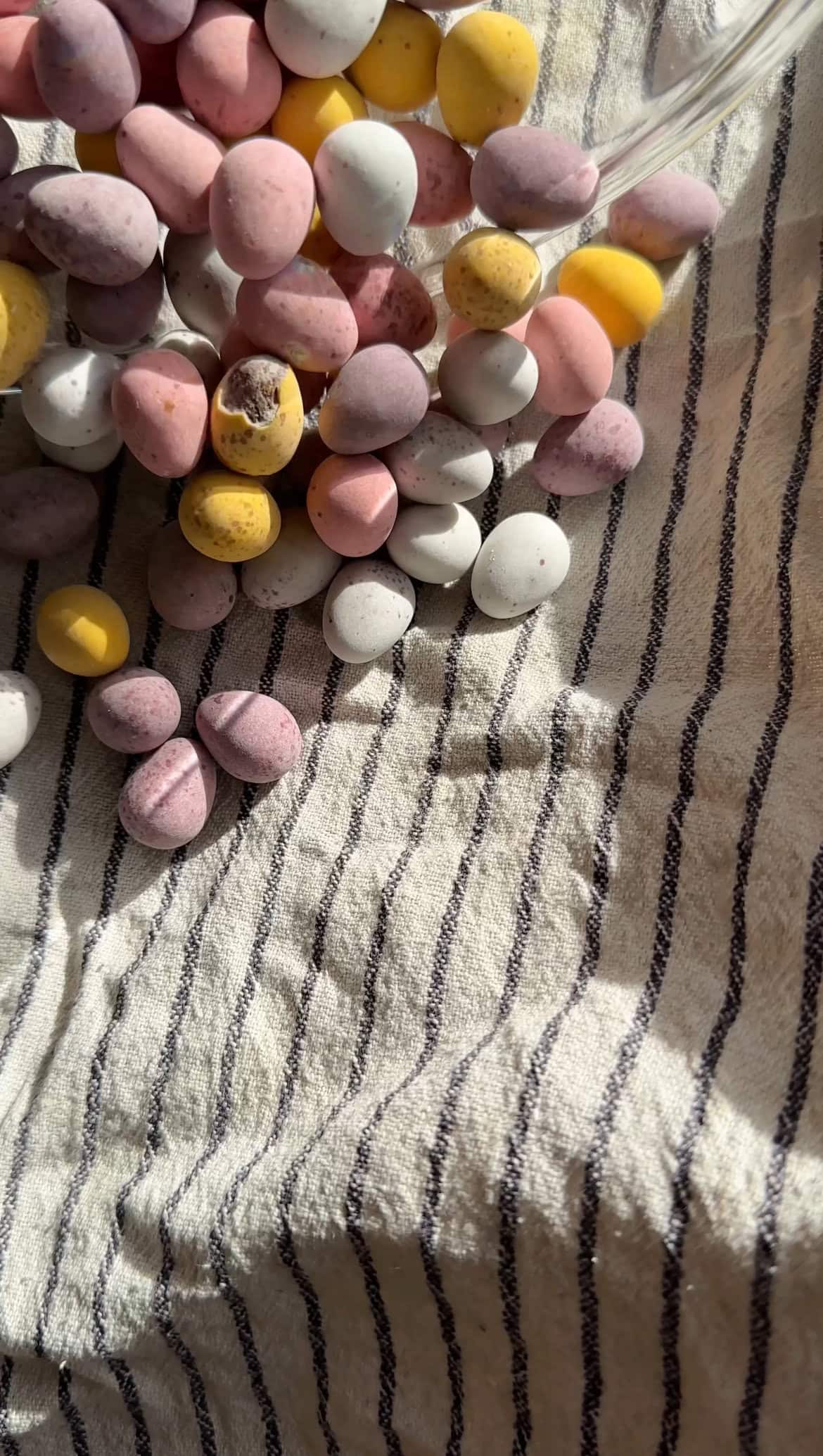 crushed mini eggs in tea towel.