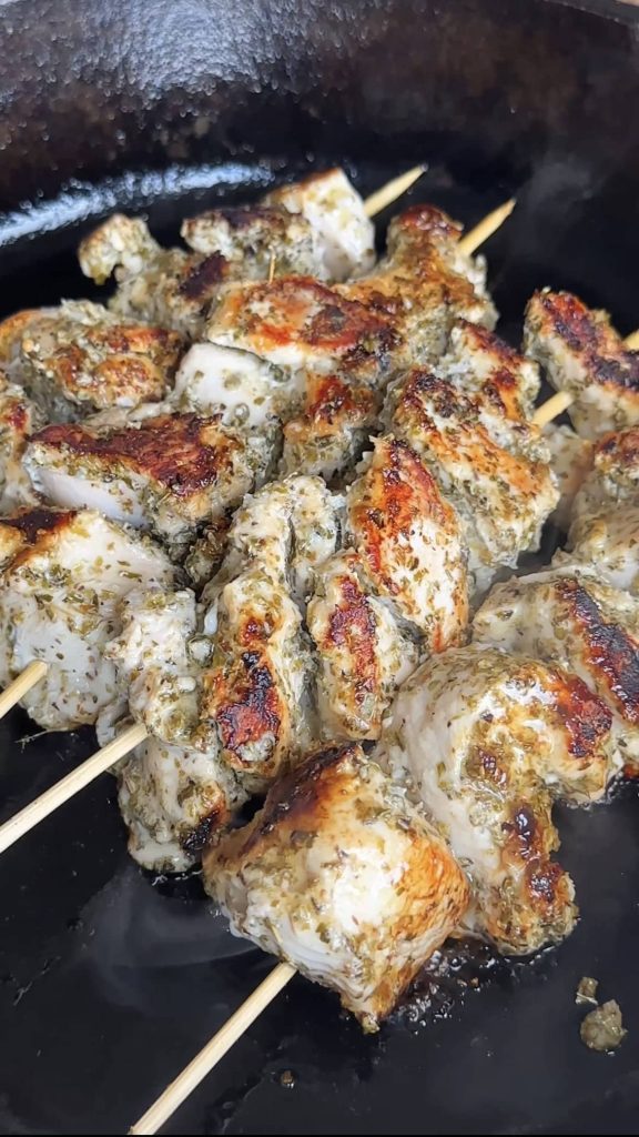 grilling marinated chicken souvlaki skewers