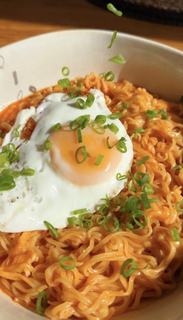 Korean Spicy Ramen Noodles with cheese and a fried egg on top