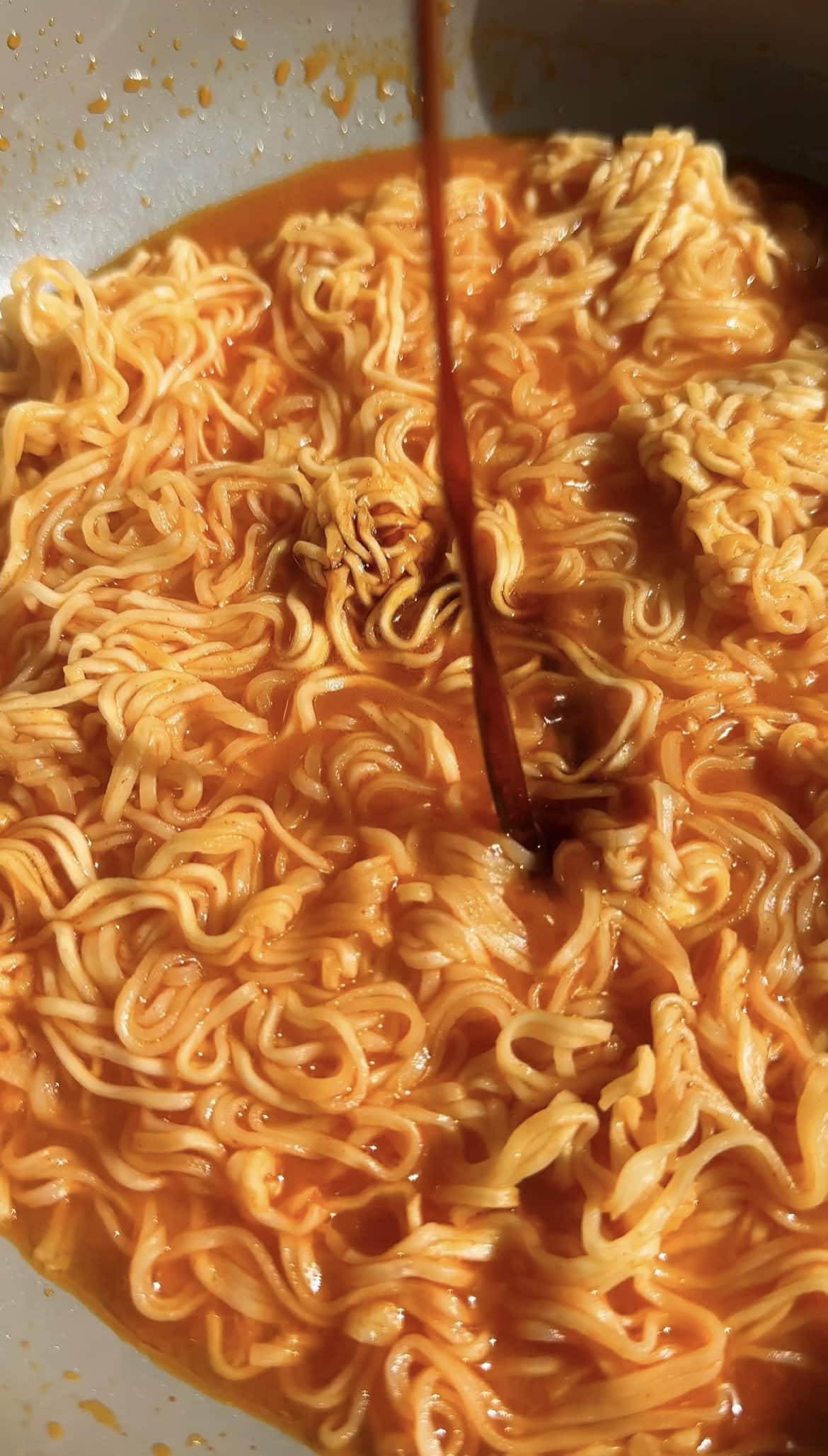 Adding soy sauce to korean spicy ramen noodles