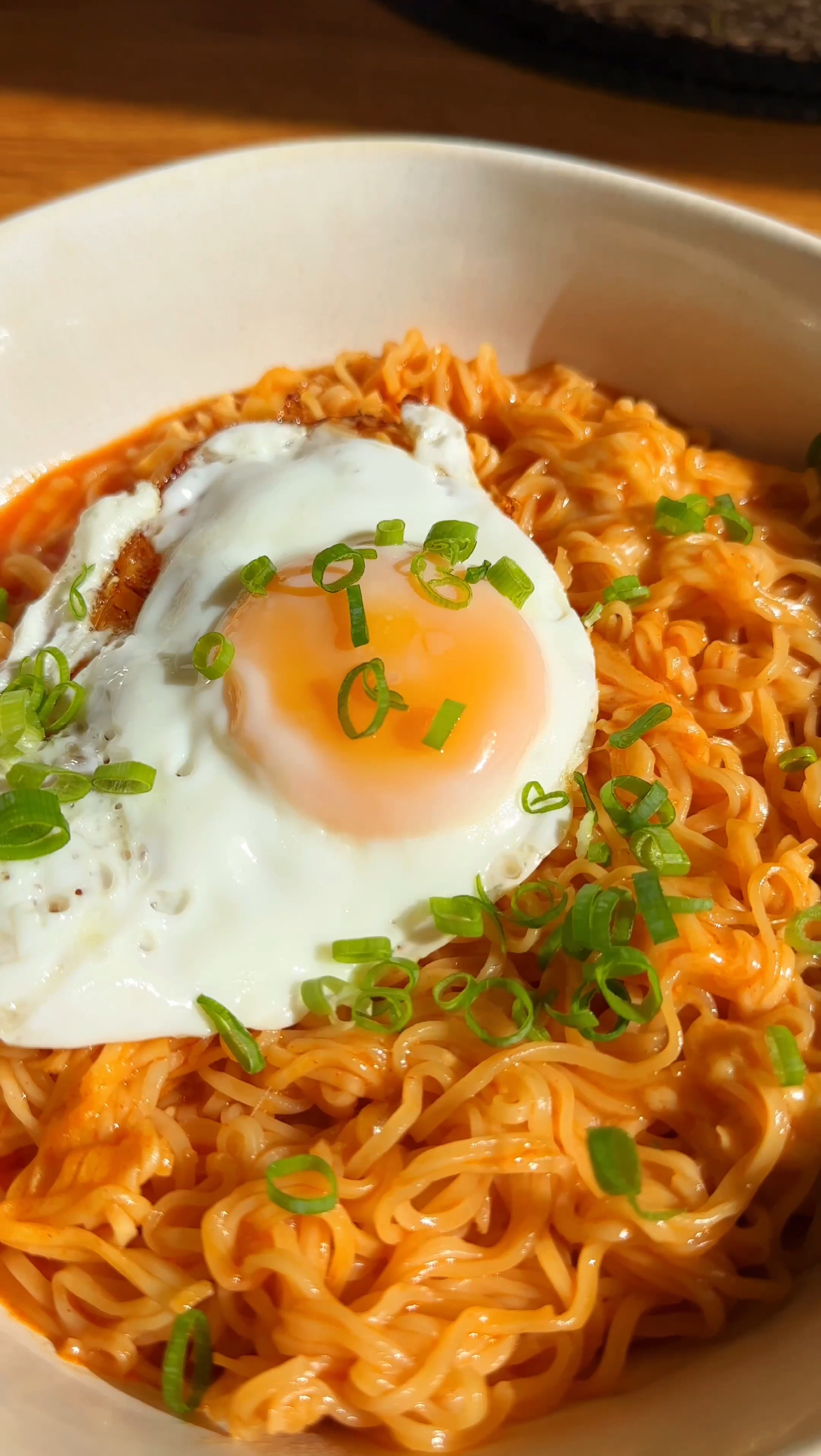 Korean Spicy Ramen Noodles with cheese and a fried egg on top