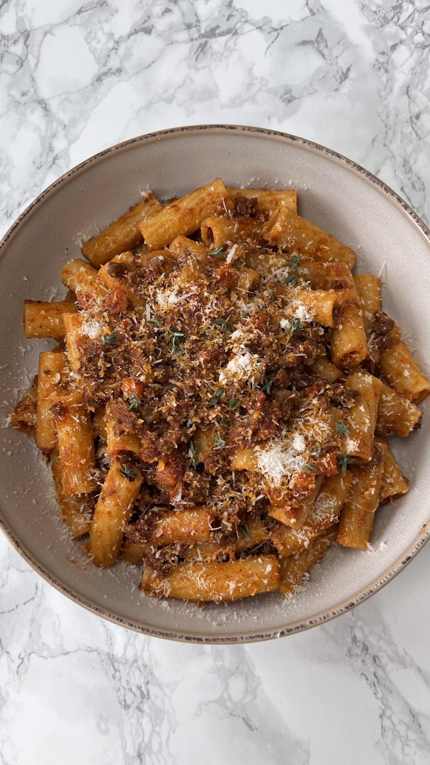 quick bolognese sauce with rigatoni 2quick bolognese sauce with rigatoni in a beige bowl