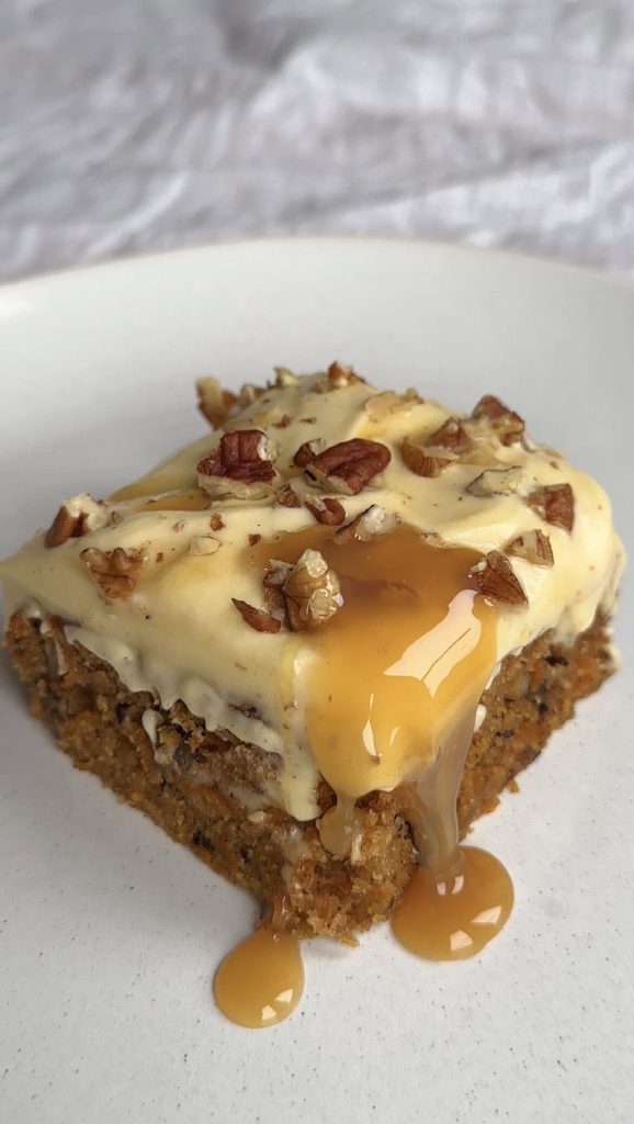 carrot sheet cake slice on a white plate