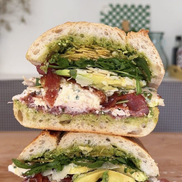 stack of chicken bacon sandwich on wooden board