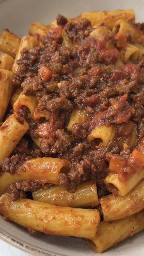 close up of quick bolognese sauce in rigatoni