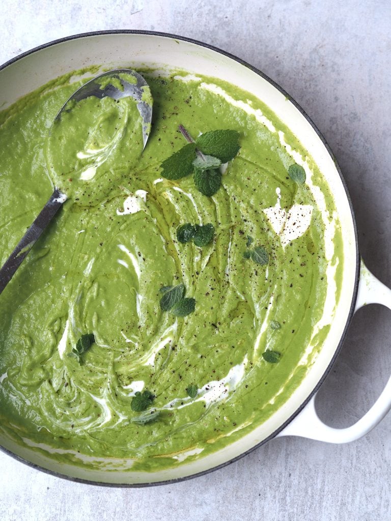 close up of little gem, pea, mint soup in a pan