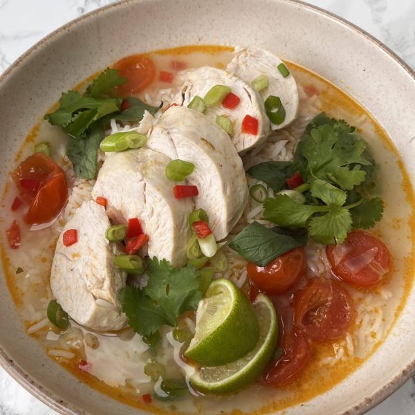 Thai Chicken Soup With Rice in a beige bowl