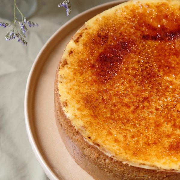 creme brulee cheesecake on pink plate