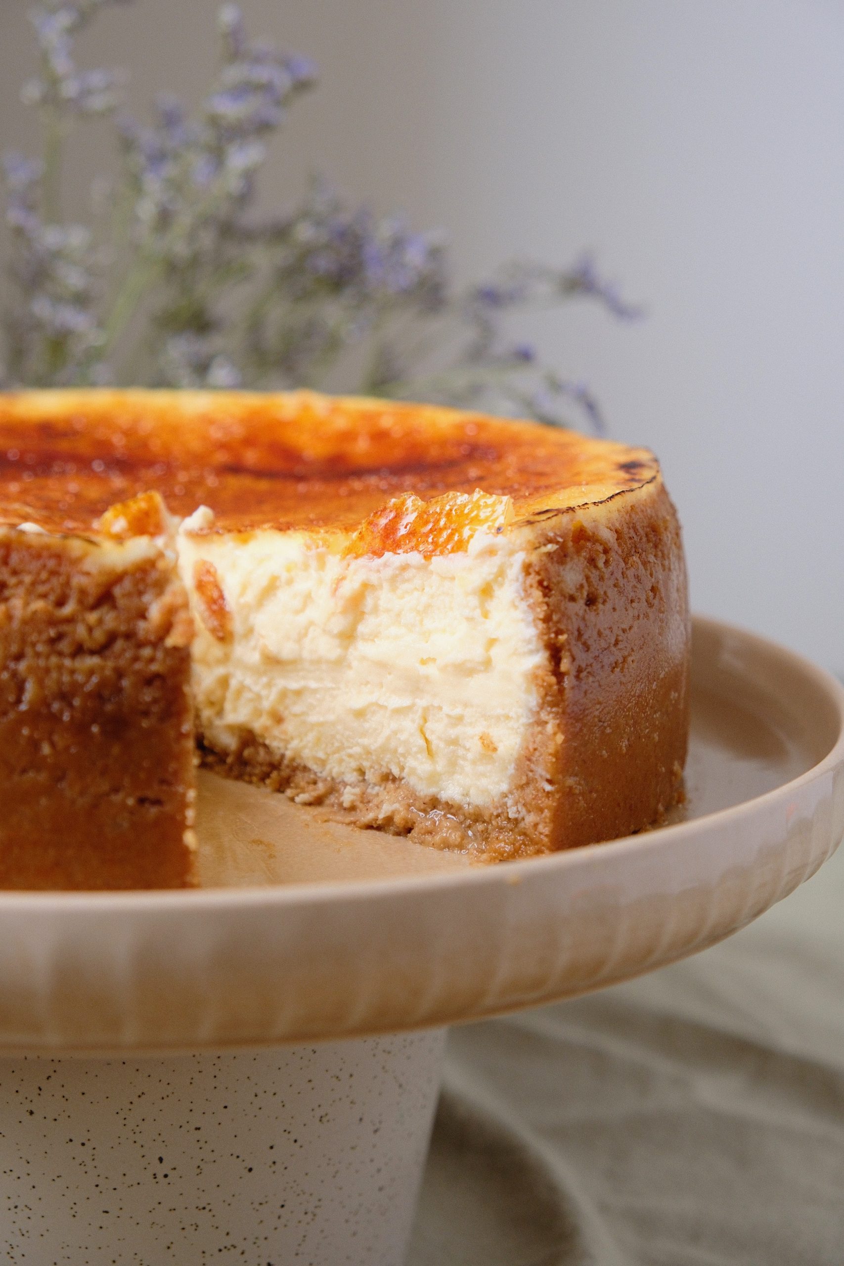 a slice removed from creme brulee cheesecake