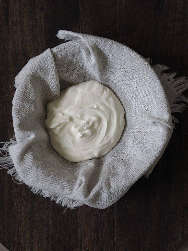 Labneh straining in a bowl.