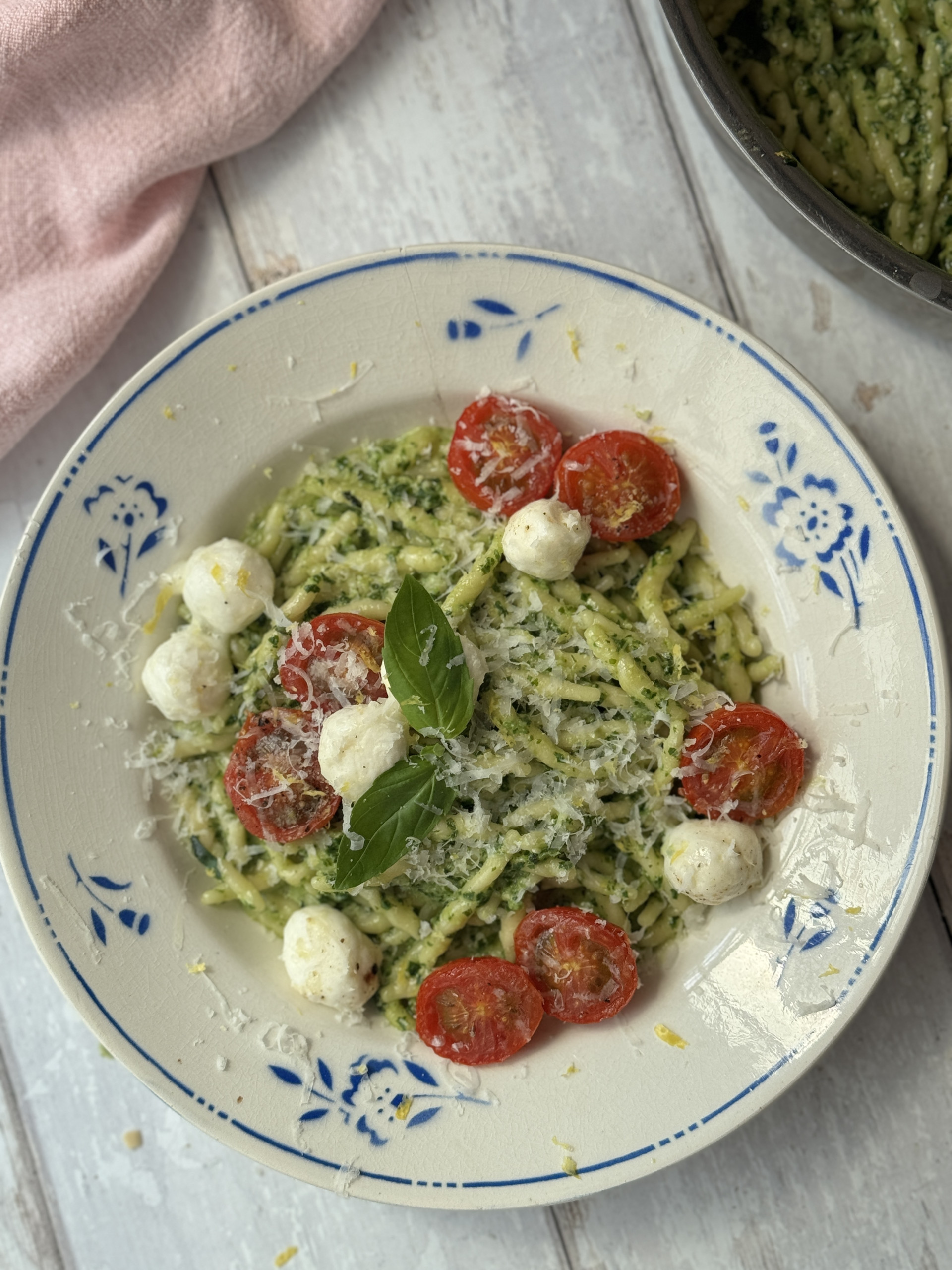 pasta al pesto in a white bowl