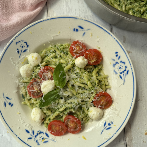 pasta al pesto in a white bowl