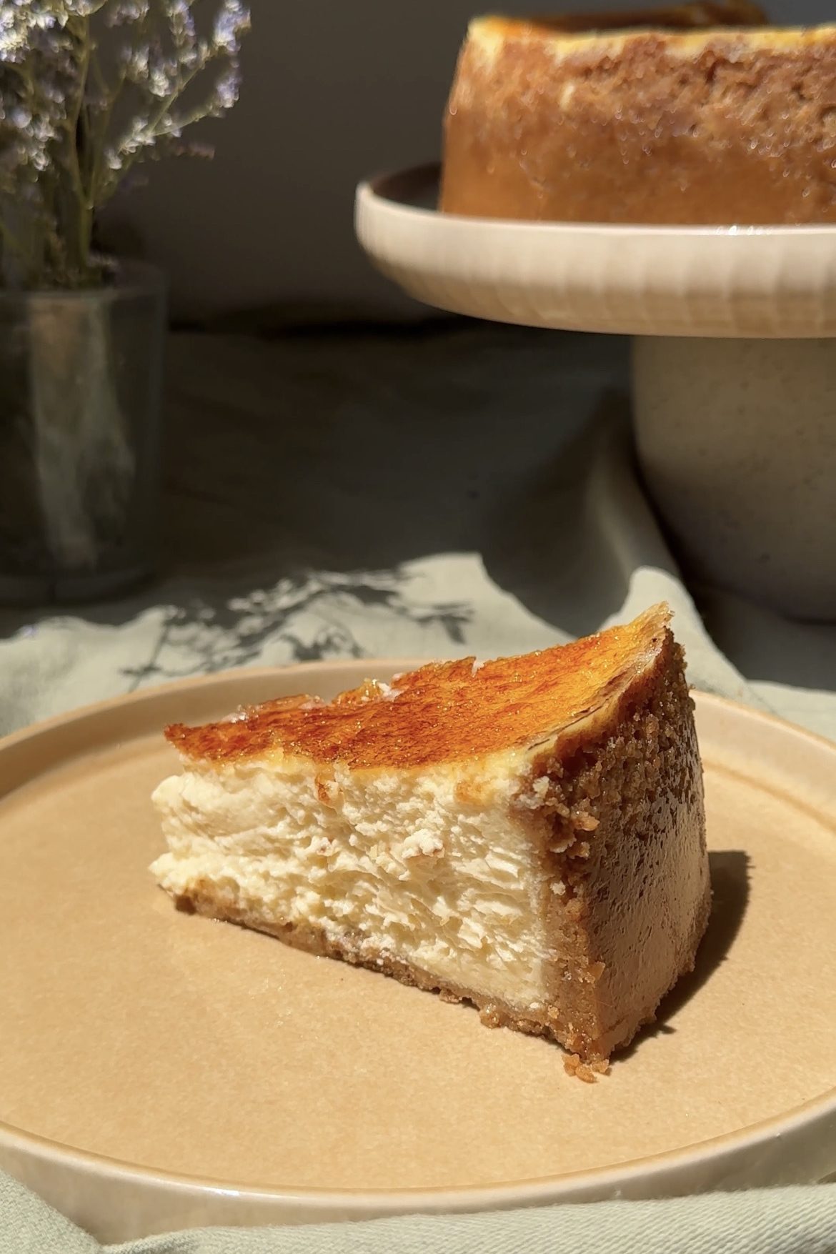 slice of creme brulee cheesecake on a plate