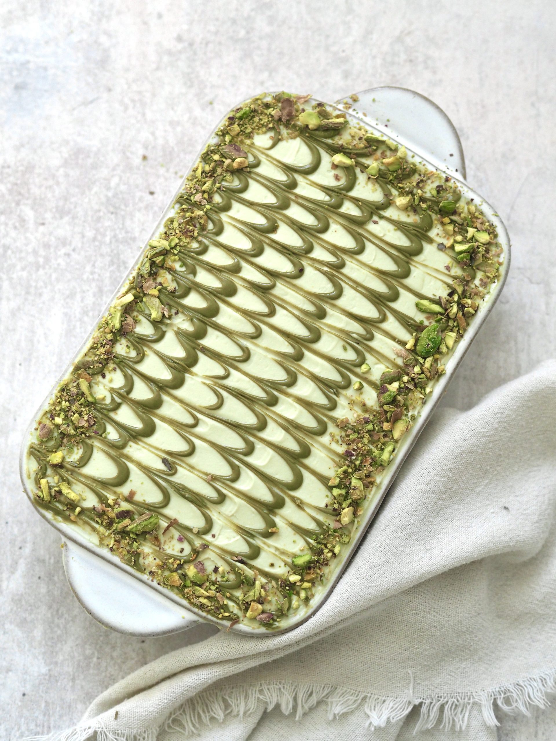 pistachio tiramisu in white dish