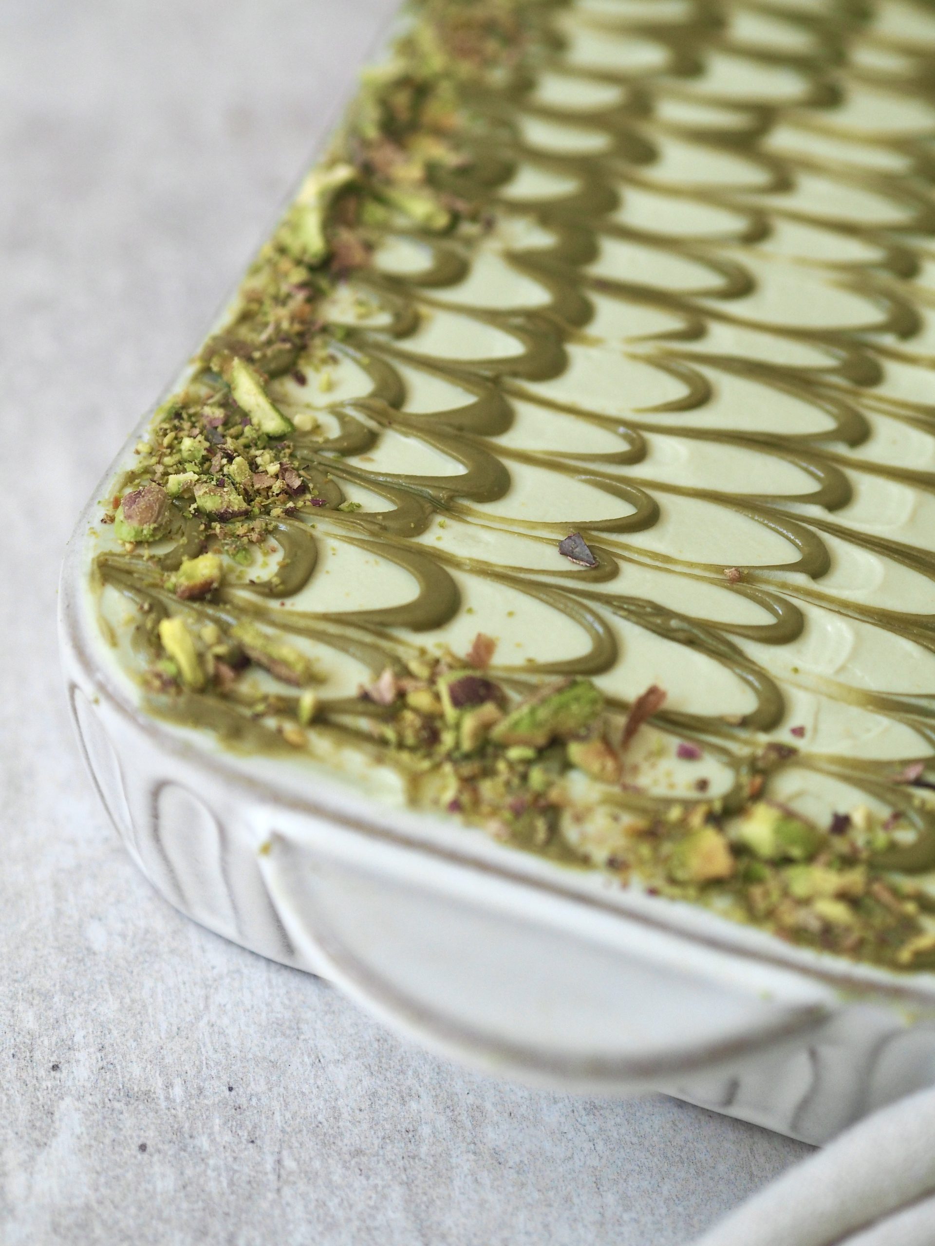 pistachio tiramisu in white dish