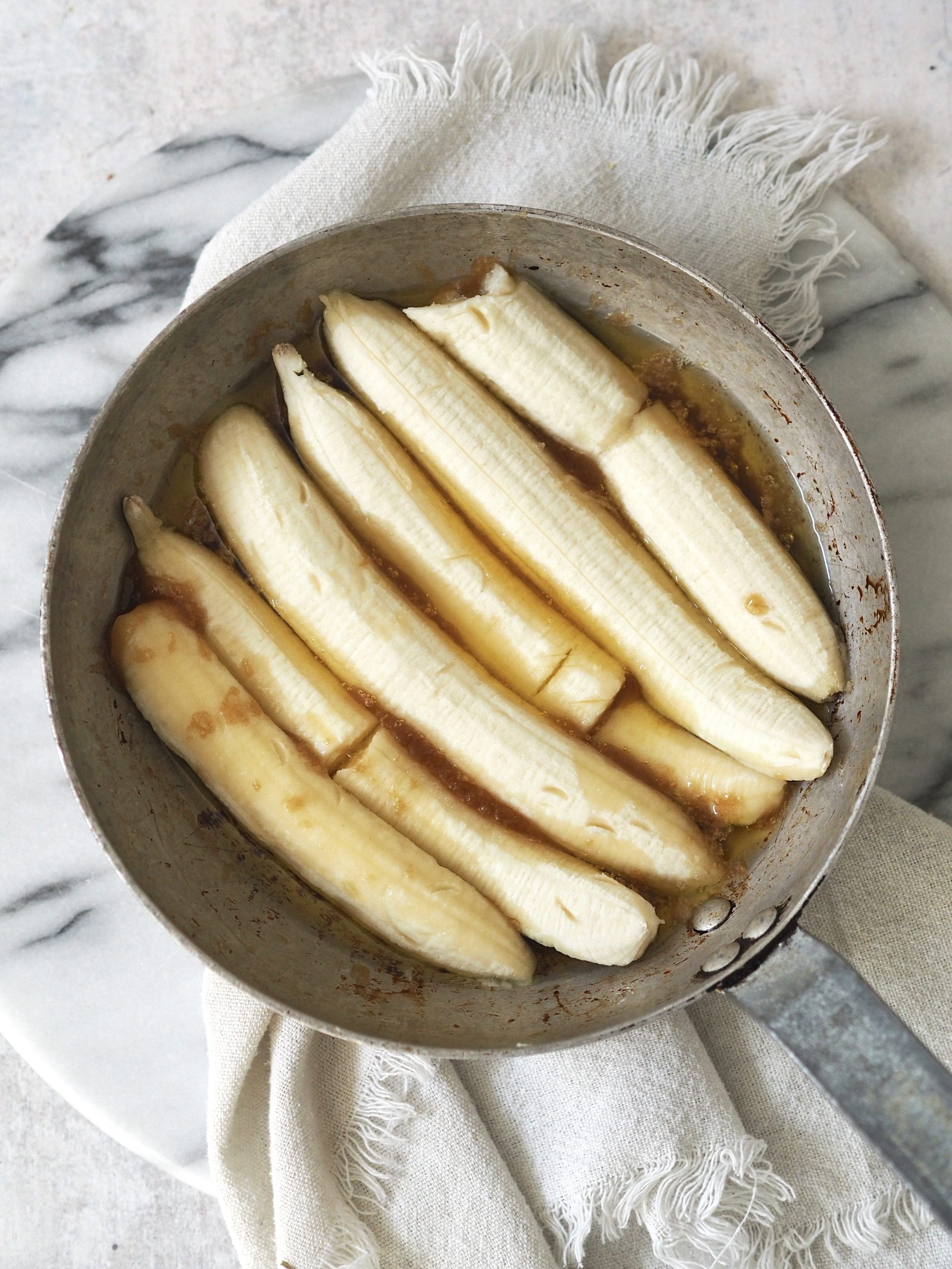 bananas in the pan for upside down banana cake