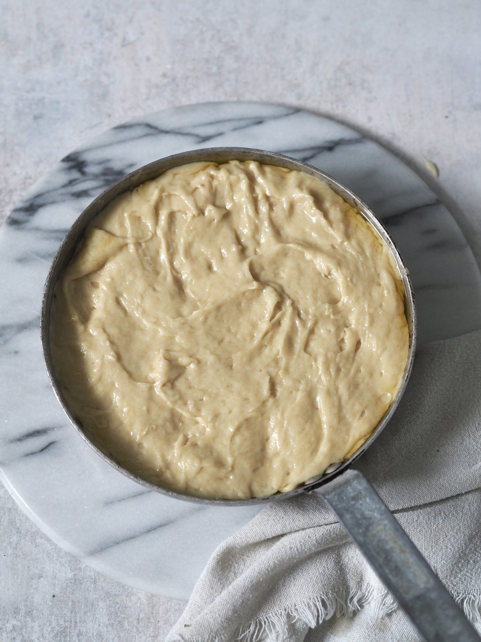 upside down banana cake in a pan before baking