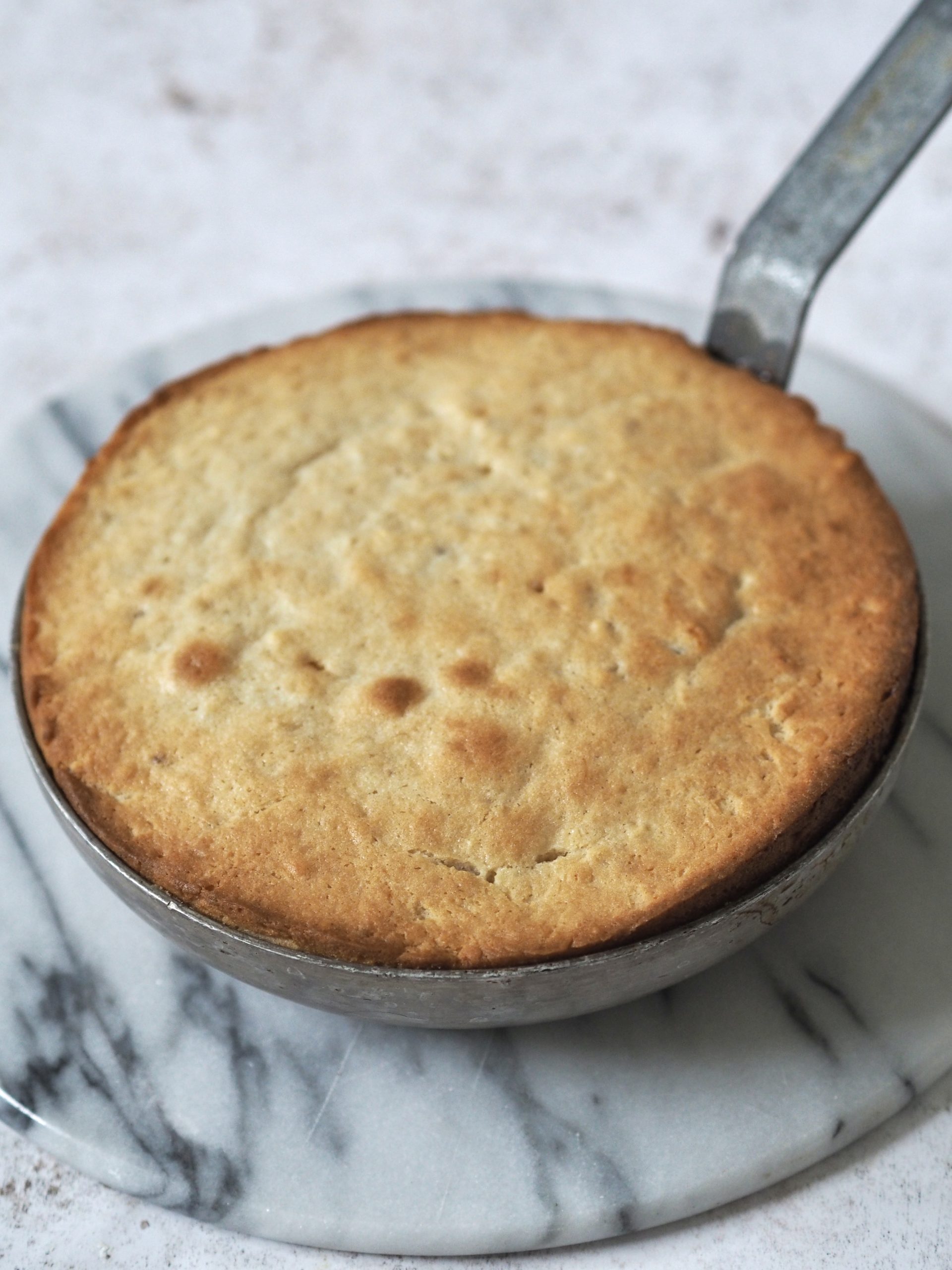 upside down banana cake in a pan after baking