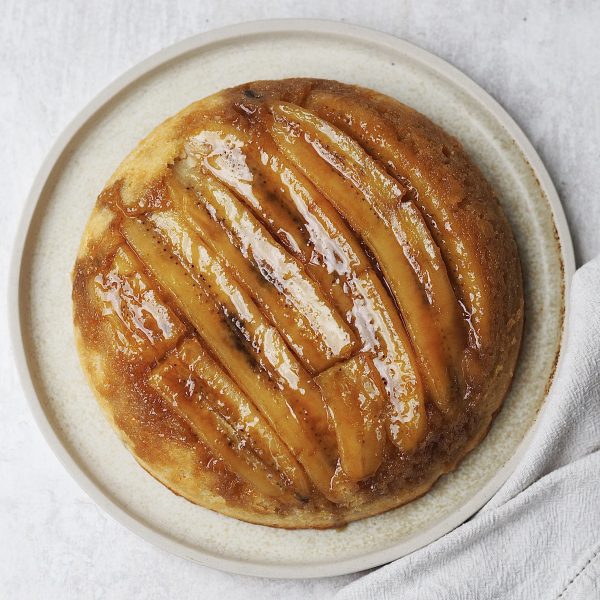 upside down banana cake on a white plate