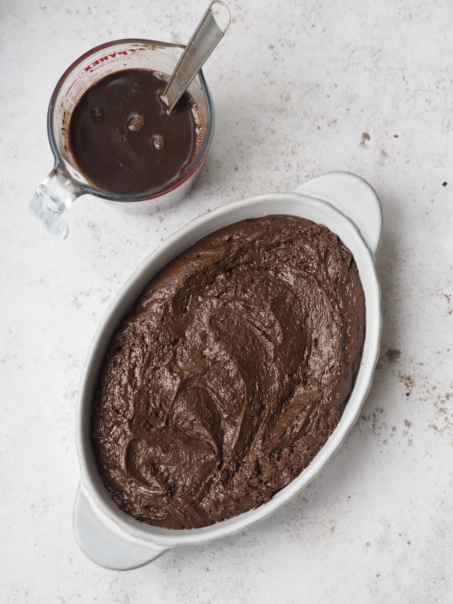 Self Saucing Chocolate Pudding in a white baking dish