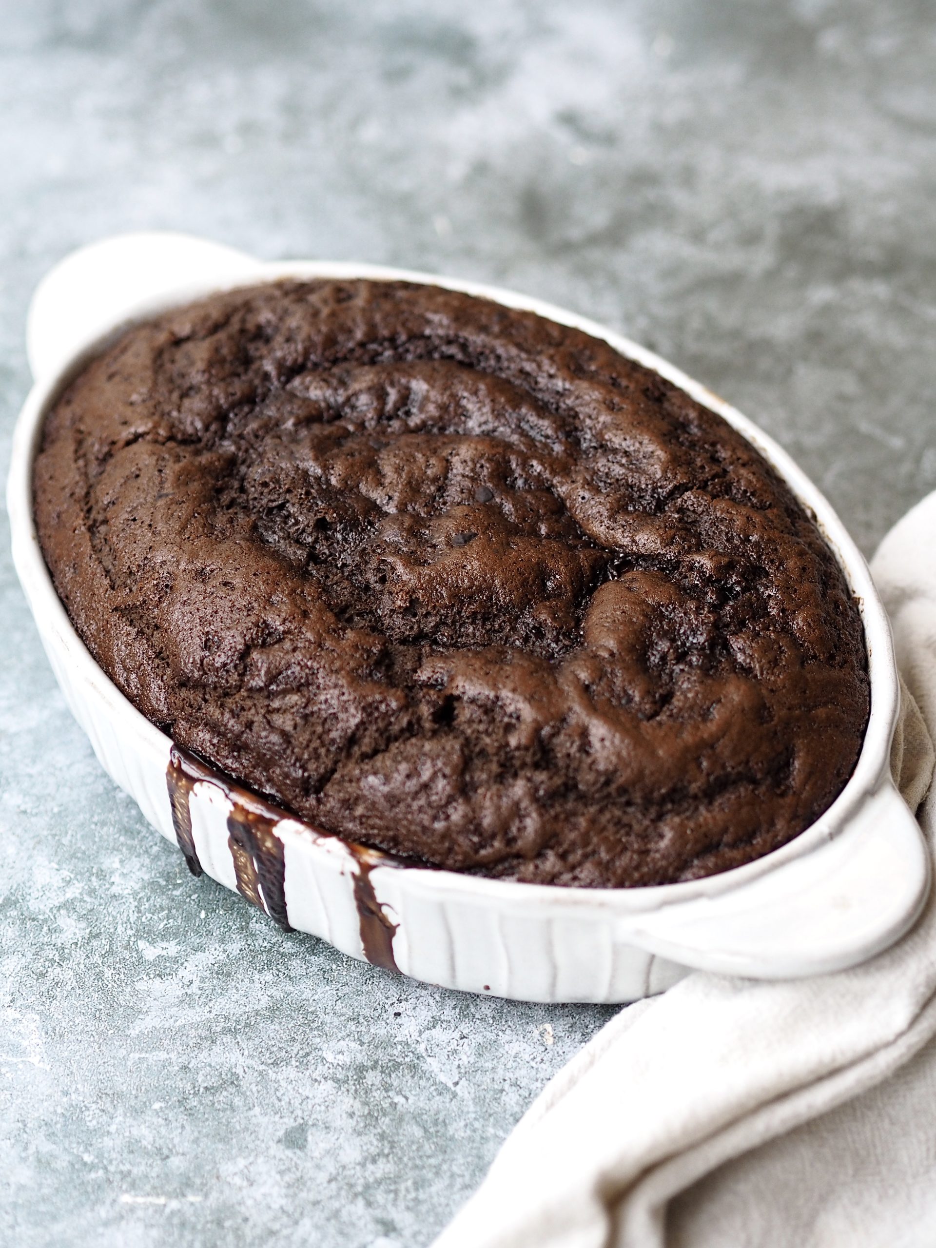 Self Saucing Chocolate Pudding in a white baking dish