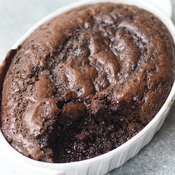 Self Saucing Chocolate Pudding in a white baking dish